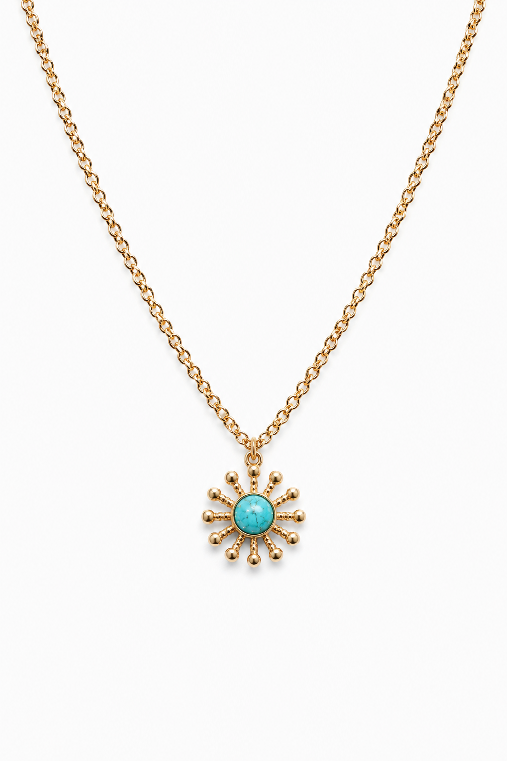 Gold necklace with a turquoise pendant on a white background