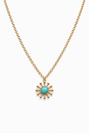 Gold necklace with a turquoise pendant on a white background